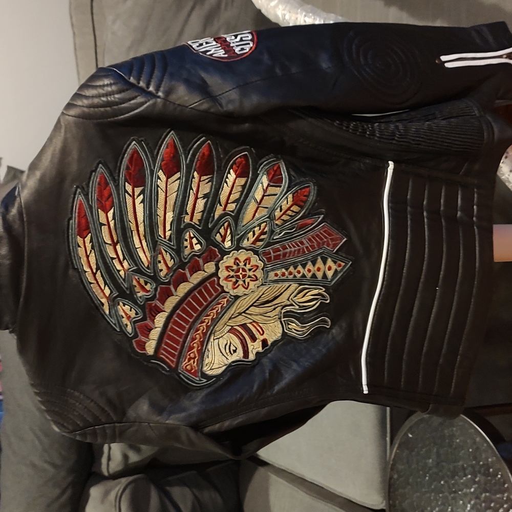 Real Leather quilted jacket w/ Affliction style patches on it.